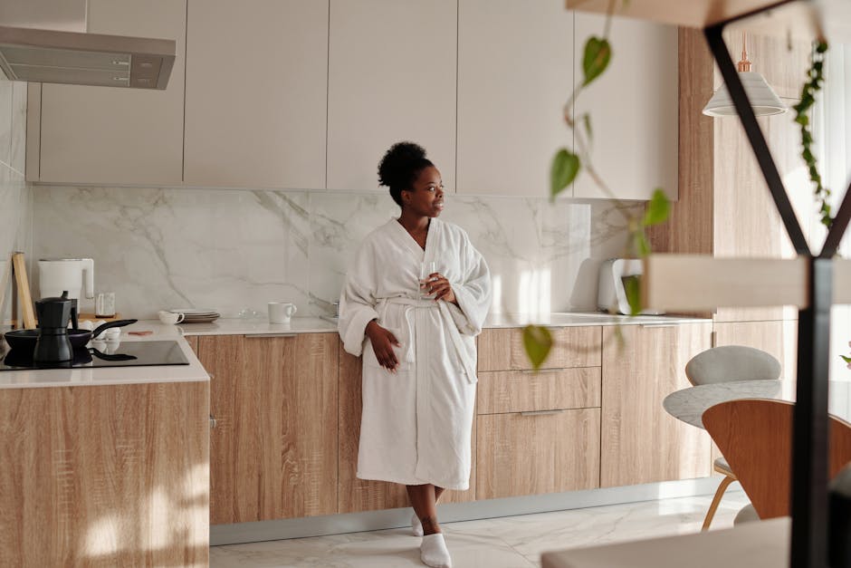 woman morning routine energy wellness natural light kitchen