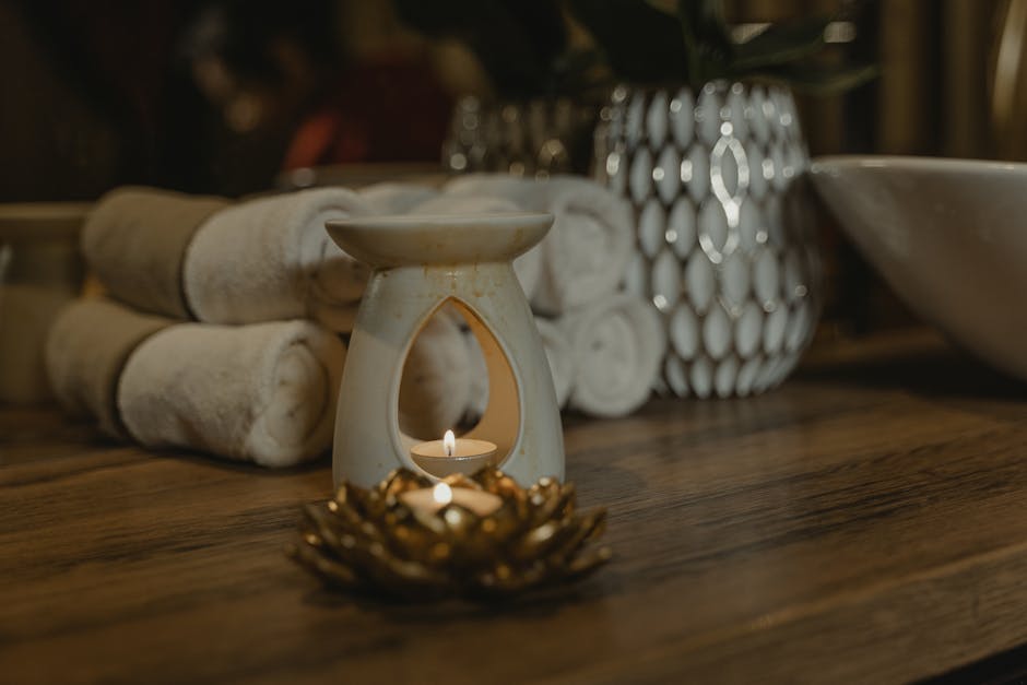cozy bathroom spa atmosphere candles towels relaxation landscape