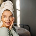 young woman healthy glowing skin morning skincare routine landscape