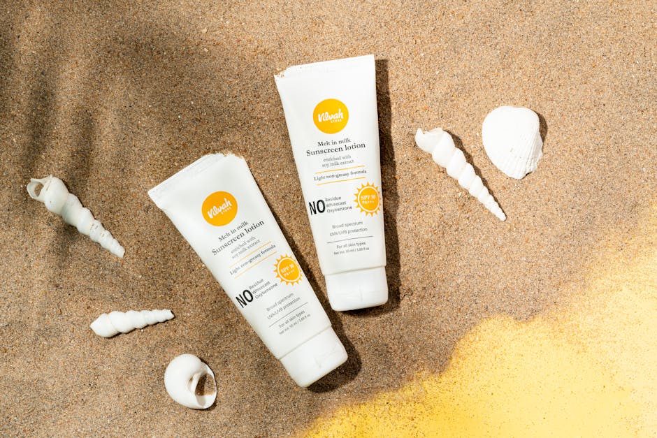40 ans et soleil : comment protéger votre peau du vieillissement cutané accéléré sunscreen bottle spf 50 summer beach skincare products