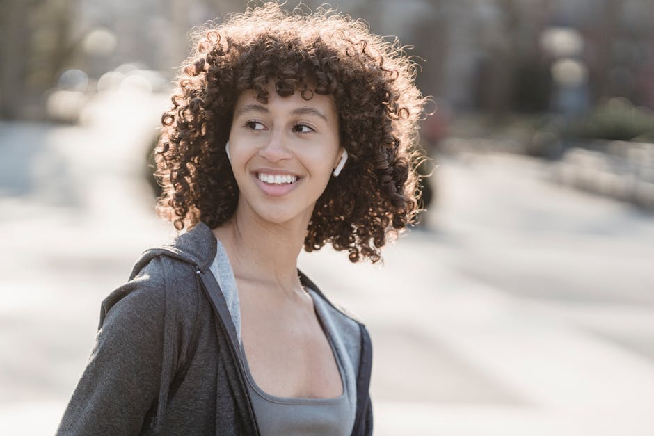 woman enjoying morning sunlight outdoors smiling peacefully