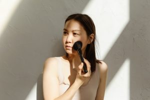 woman rushed morning beauty routine quick makeup skincare landscape