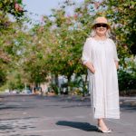 elegant mature woman 60s summer outdoor sun protection skincare landscape