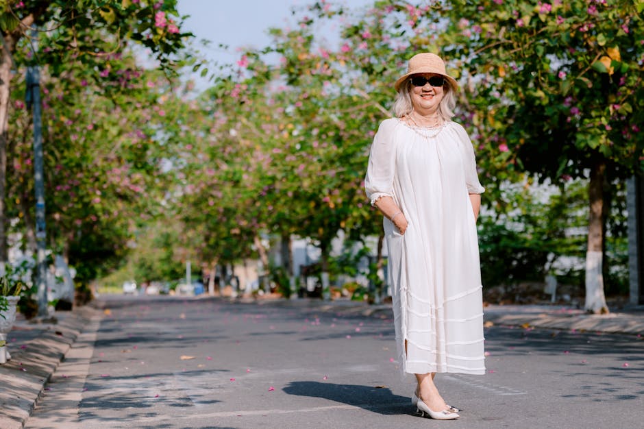 elegant mature woman 60s summer outdoor sun protection skincare landscape