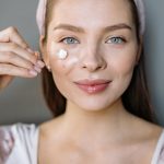 woman skincare anti-aging face cream smile lines natural beauty landscape