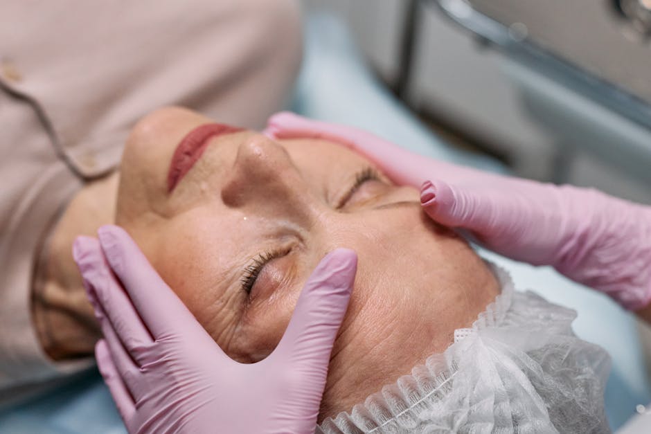 woman touching forehead between eyebrows skincare anti-aging landscape