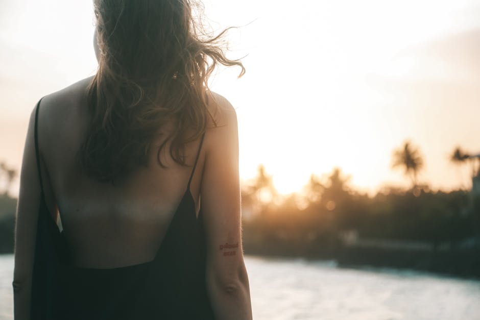 woman glowing tan skin autumn beauty routine golden hour