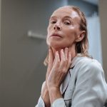 elegant mature woman skincare anti-aging routine natural light portrait