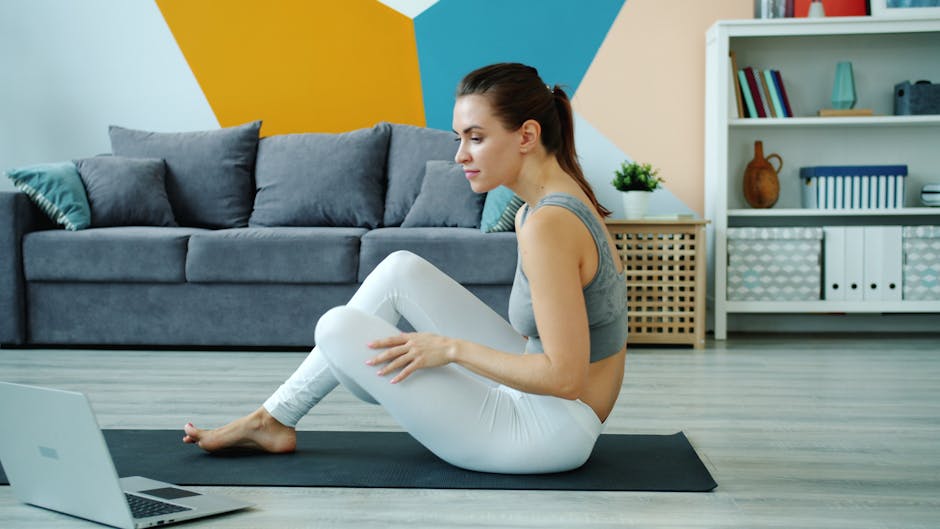 woman doing neck stretching exercises at home yoga mat bright room