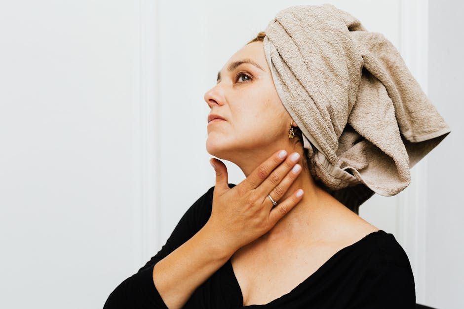 woman applying neck cream upward strokes serene skincare routine