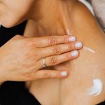 woman skincare neck decollete firming cream natural light landscape