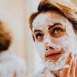 woman foaming face wash cleanser skincare landscape natural light