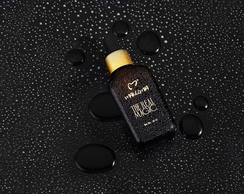 Huile d'argan en hiver : bienfaits, utilisation et conseils pour une peau douce malgré le froid argan oil golden drops dark background beauty product