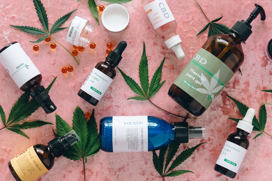 Huile de coco : bienfaits pour la peau et les cheveux, conseils d'utilisation various natural plant oils in glass bottles flat lay