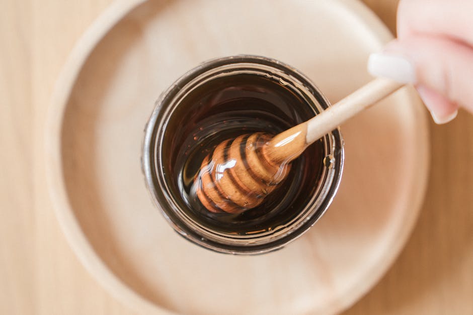 homemade black charcoal face mask honey wooden spoon