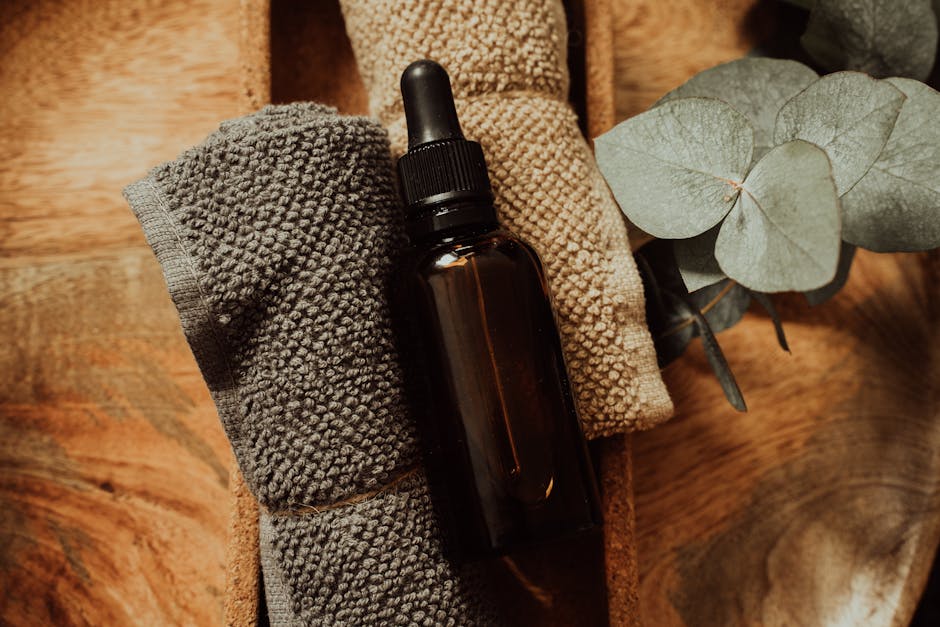 Huiles visage et corps : guide complet pour choisir et utiliser les huiles de soin various plant oils glass bottles wooden surface natural skincare