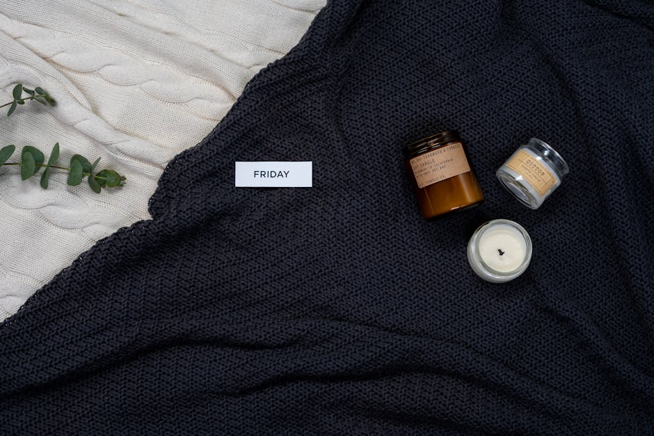 Hygge et beauté : comment créer une routine bien-être inspirée de l'art de vivre scandinave woman relaxing with face mask candles and warm blanket at home
