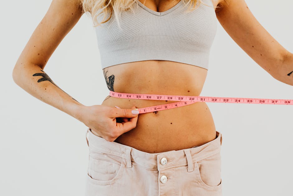 woman measuring waist healthy lifestyle concept bright background