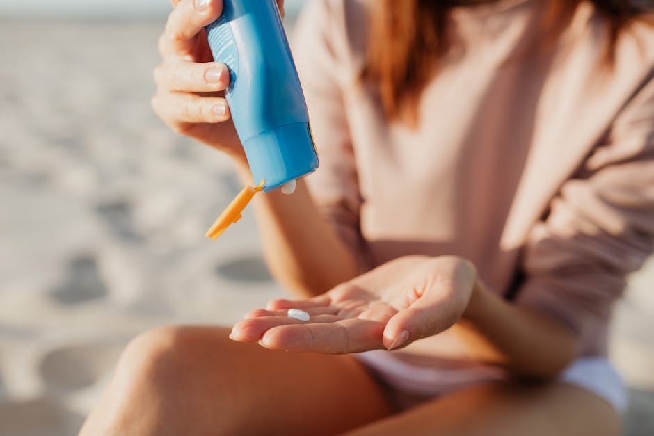 woman outdoor spring sunlight applying face sunscreen protection skincare