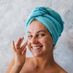 woman mature glowing skin facial care routine natural light portrait