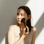 woman summer skincare routine beauty preparation bright natural light landscape