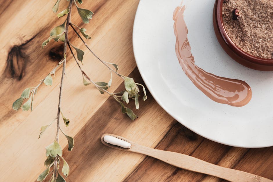 Peau noire et acné : comprendre, prévenir et atténuer les imperfections durablement skincare routine products for dark skin tones on a wooden surface