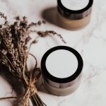 natural organic skincare ingredients herbs flowers cosmetics flat lay