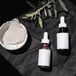 collection of natural plant oils glass bottles beauty skincare flat lay