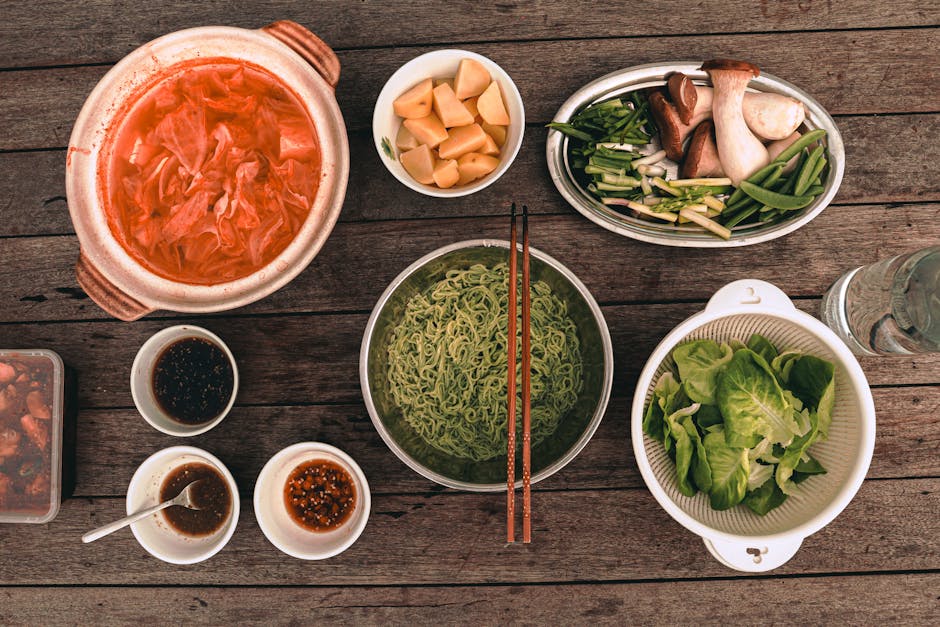 8 aliments anti-acné à intégrer dans votre assiette dès maintenant flat lay anti-acne foods seafood vegetables nuts green tea wooden table