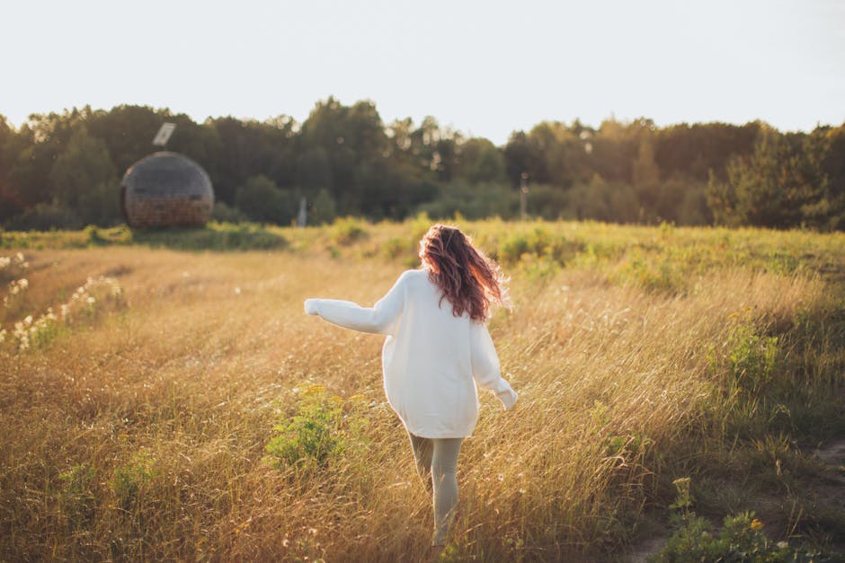 woman walking outdoors nature landscape wellness