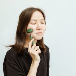 woman natural anti-aging skincare routine facial massage landscape